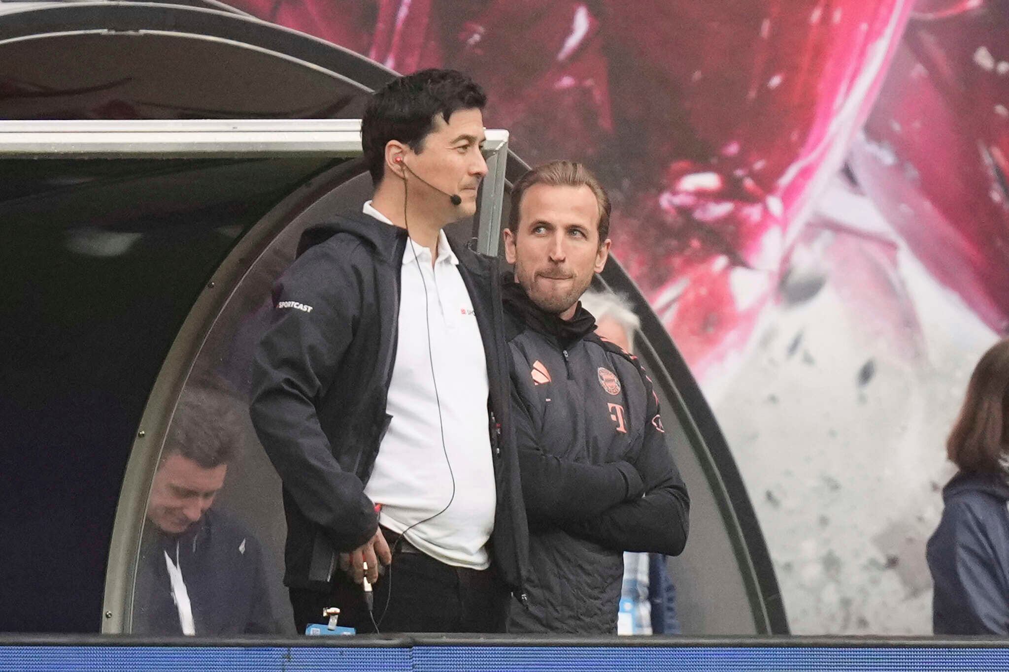 Bayern's Harry Kane, right, reacts after Leipzig's Yussuf Poulsen, scored his side's third goal during the German Bundesliga soccer match between RB Leipzig and FC Bayern Munich at the Red Bull Arena in Leipzig, Germany, Saturday, May 3, 2025. (AP Photo/Matthias Schrader)