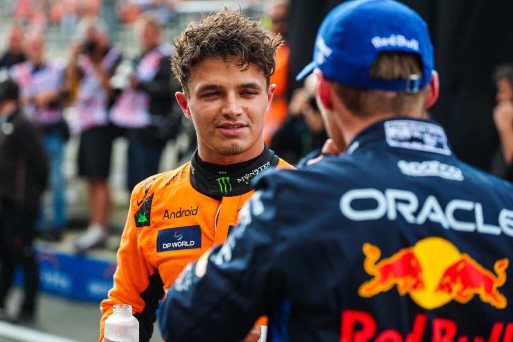 ZANDVOORT, NETHERLANDS - AUGUST 24: Lando Norris of Great Britain and McLaren and Max Verstappen of Netherlands and Oracle Red Bull Racing chat in parc ferme during practice/qualifying ahead of the F1 Grand Prix of Netherlands at Circuit Zandvoort on August 24, 2024 in Zandvoort, Netherlands. (Photo by Kym Illman/Getty Images)