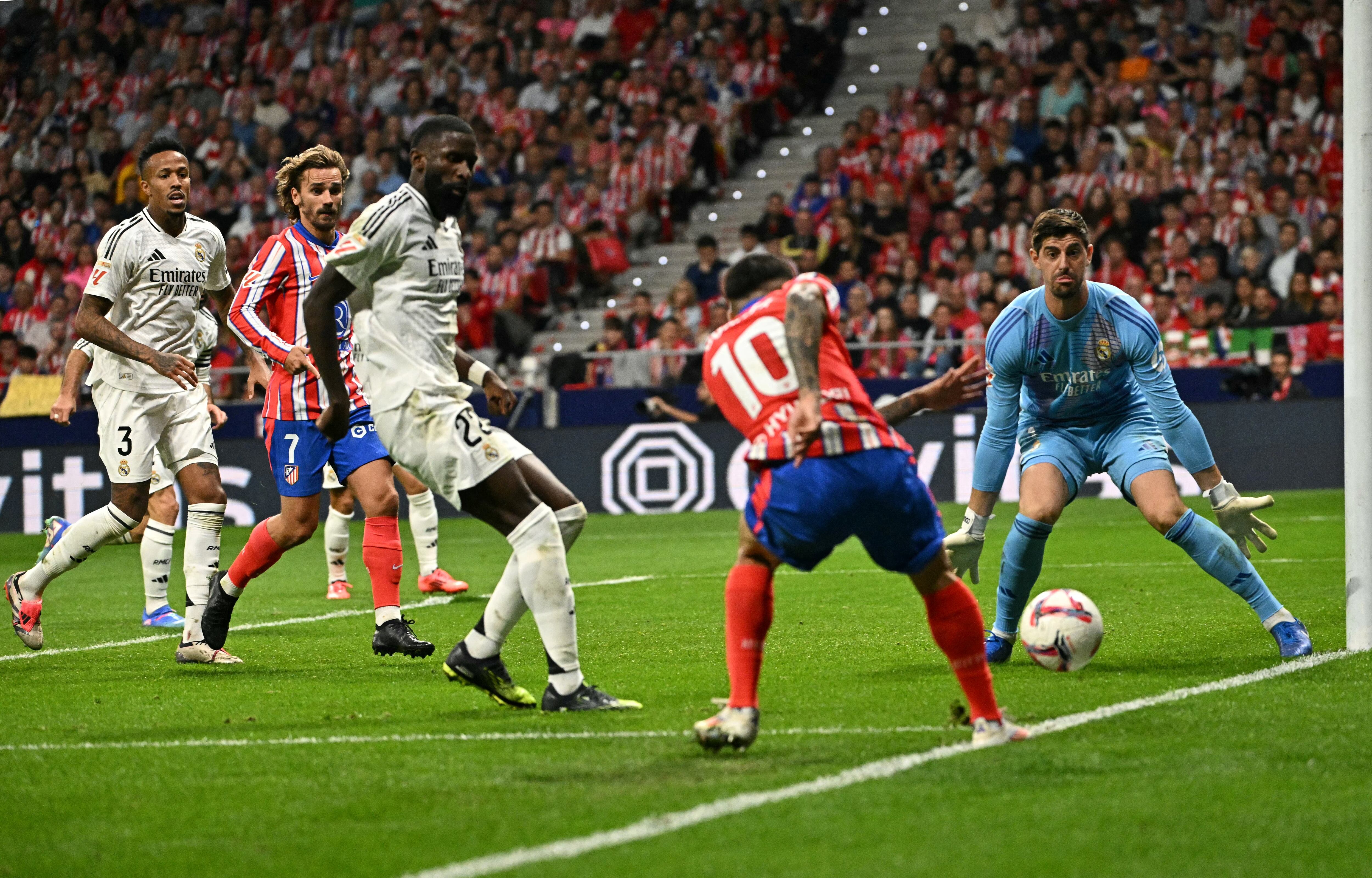 Real Madrid's Belgian goalkeeper #01 Thibaut Courtois eyes the ball during the Spanish league football match between Club Atletico de Madrid and Real Madrid CF at the Metropolitano stadium in Madrid on September 29, 2024. (Photo by JAVIER SORIANO / AFP)