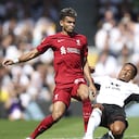 Liverpool's Luis Diaz, left, and Fulham's Kenny Tete vie for the ball during the English Premier League soccer match between Fulham and Liverpool at Craven Cottage stadium in London, Saturday, Aug. 6, 2022. (AP Photo/Ian Walton)