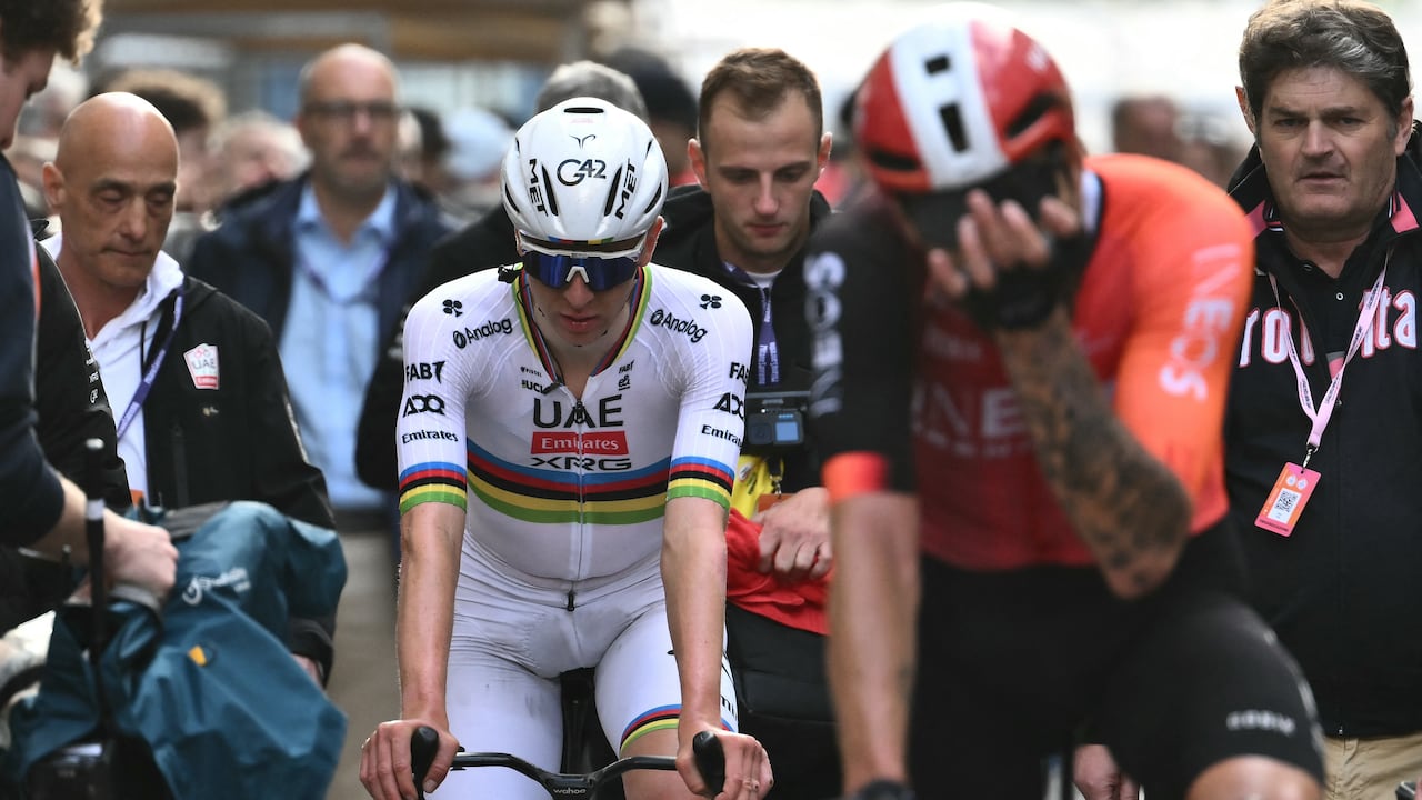 Team UAE's Slovenian rider Tadej Pogacar (L), third, and Team Ineos' Italian rider Filippo Ganna (R), second, are pictured after the Milan - Sanremo one-day classic cycling race, on March 22, 2025. Dutch Mathieu Van Der Poel of team Alpecin-Deceuninck won the race ahead of Team Ineos' Italian rider Filippo Ganna and Team UAE's Slovenian rider Tadej Pogacar, third. (Photo by Marco BERTORELLO / AFP)