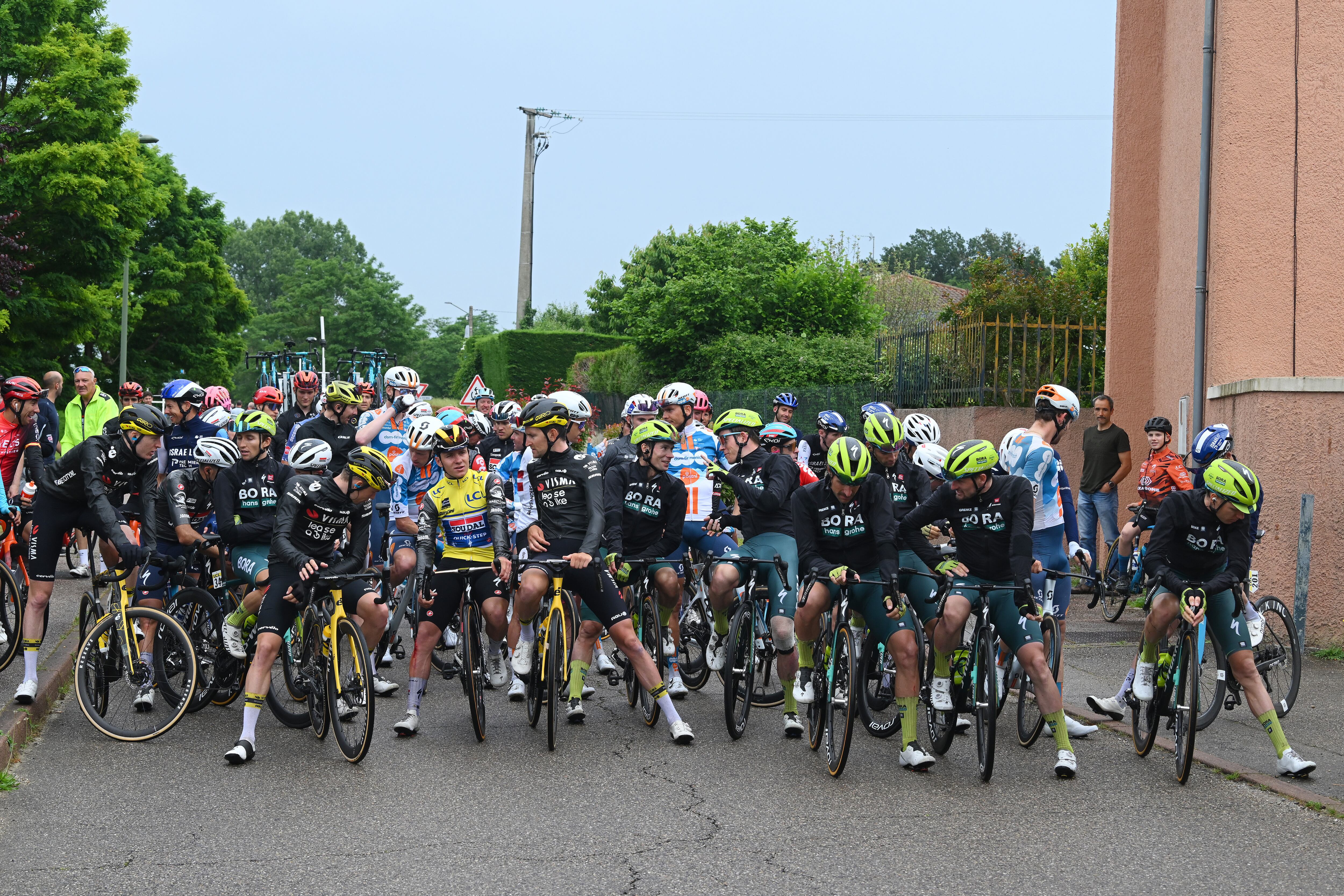 BOISSET-SAINT-PRIEST, FRANCE - JUNE 06: A general view of Remco Evenepoel of Belgium and Team Soudal Quick-Step - Yellow leader jersey and the peloton neutralization of the race due to a multiple fall during the 76th Criterium du Dauphine 2024, Stage 5 a 167km stage from Amplepuis to Saint-Priest / #UCIWT / on June 06, 2024 in Boisset-Saint-Priest, France. (Photo by Dario Belingheri/Getty Images)