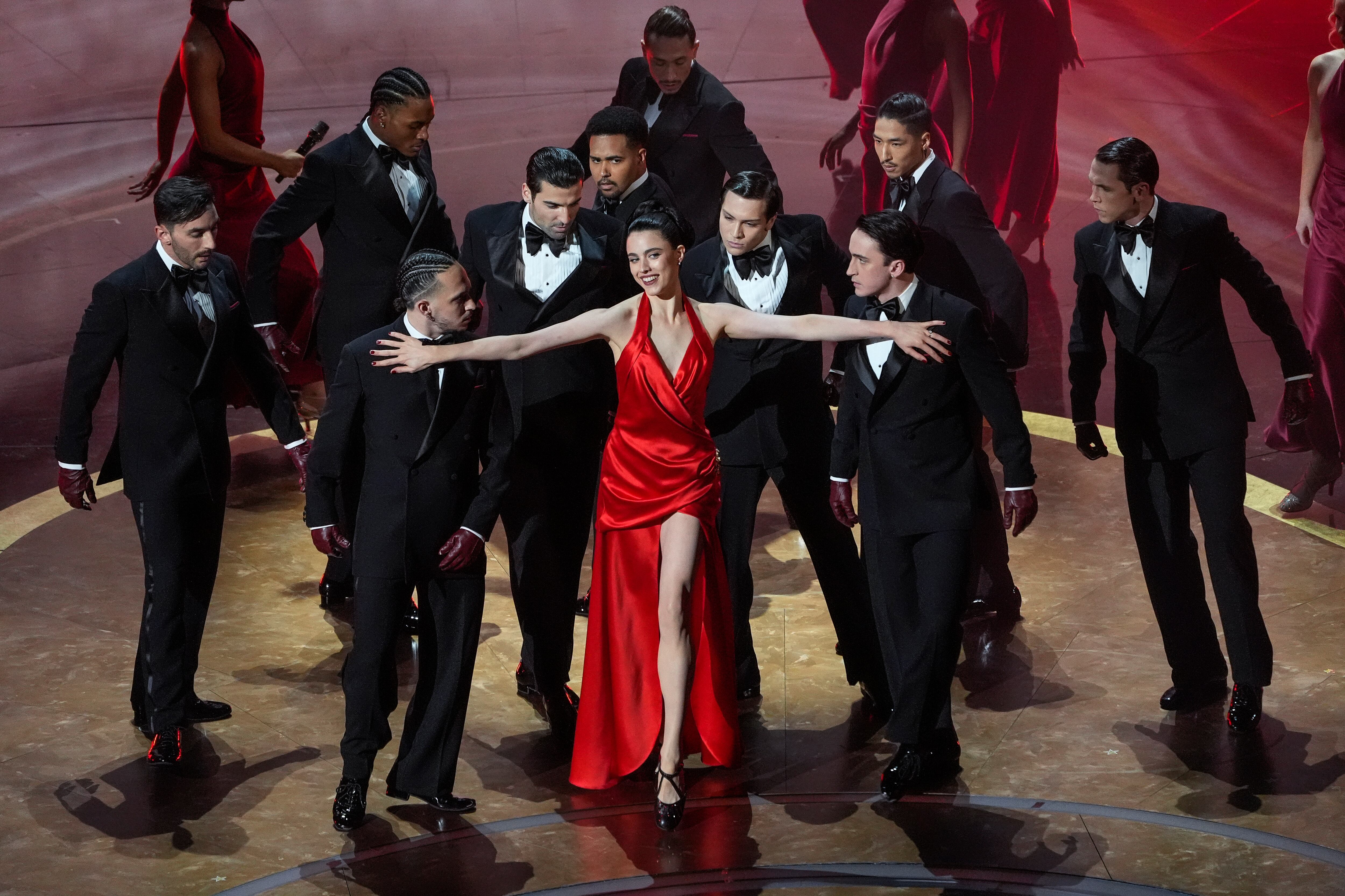 Margaret Qualley, center, performs during the Oscars on Sunday, March 2, 2025, at the Dolby Theatre in Los Angeles. (AP Photo/Chris Pizzello)