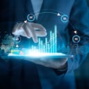 Businessman using tablet analyzing sales data and economic growth graph chart on virtual interface. Business strategy. Abstract icon. Digital marketing.