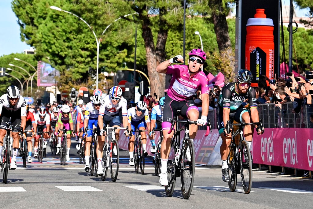 France's Arnaud Demare outsprints Slovakia's Peter Sagan, right, to win the seventh stage of the Giro d'Italia cycling race, from Matera to Brindisi, southern Italy, Friday, Oct. 9, 2020. (Massimo Paolone/LaPresse via AP)