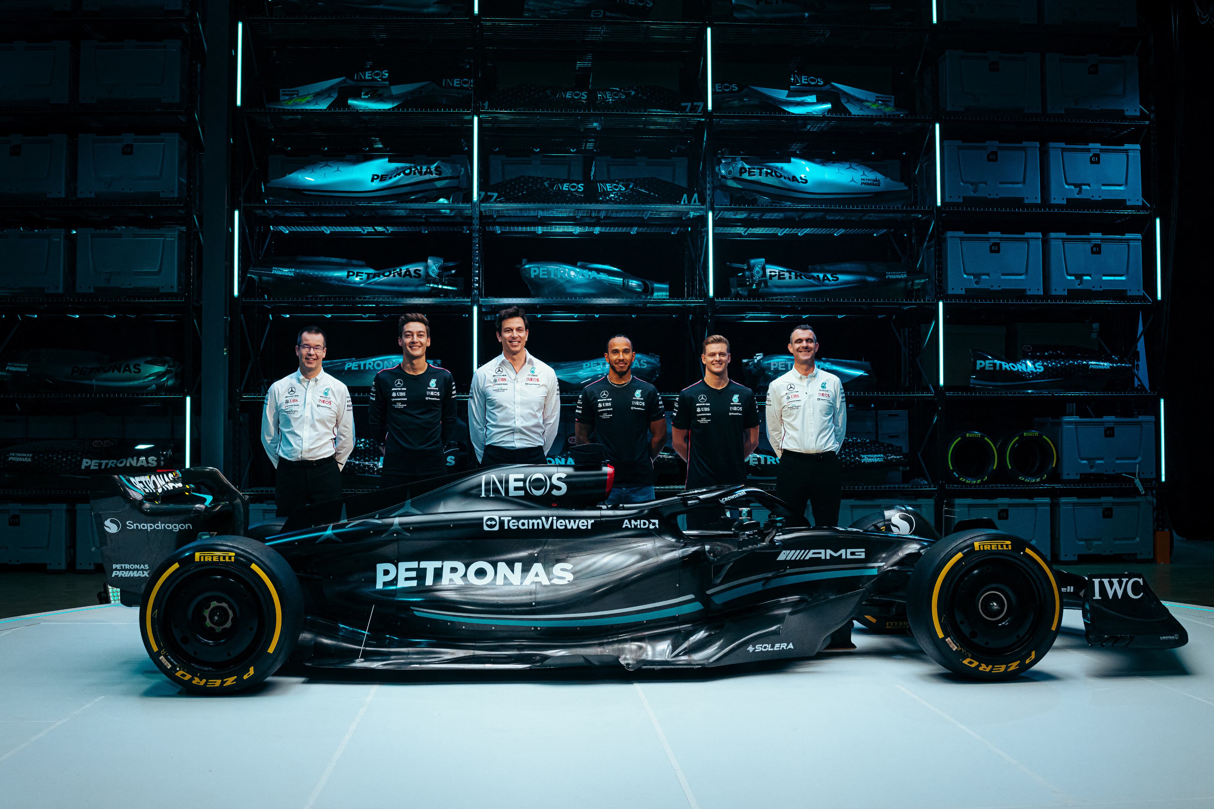 A handout image released by Mercedes shows the team's British driver George Russell (2L), Team principal Toto Wolff (3L), British driver Lewis Hamilton (3R) and reserve driver German driver Mick Schumacher (2R) posing with their new Mercedes-AMG F1 W14 E Formula One racing car during their 2023 season launch, in Silverstone on February 15, 2023. (Photo by MERCEDES / AFP) / RESTRICTED TO EDITORIAL USE - MANDATORY CREDIT "AFP PHOTO / MERCEDES-AMG" - NO MARKETING - NO ADVERTISING CAMPAIGNS - DISTRIBUTED AS A SERVICE TO CLIENTS