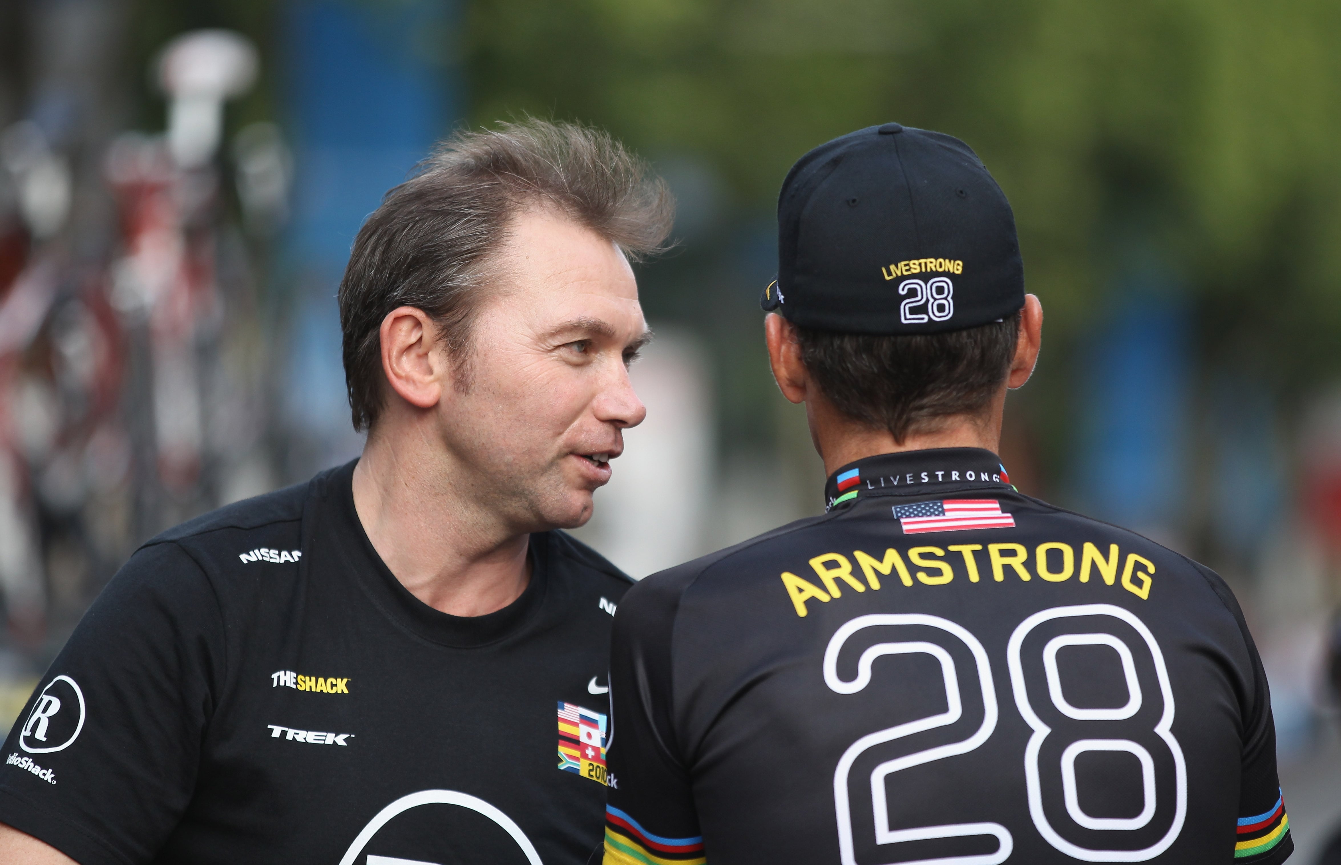 ARIS - JULY 25:  Johan Brunyeel (L) talks with Lance Armstrong of team Radioshack after the twentieth and final stage of Le Tour de France 2010, from Longjumeau to the Champs-Elysees in Paris on July 25, 2010 in Paris, France.  (Photo by Bryn Lennon/Getty Images)
