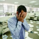 Stressed Businessman in Messy Office