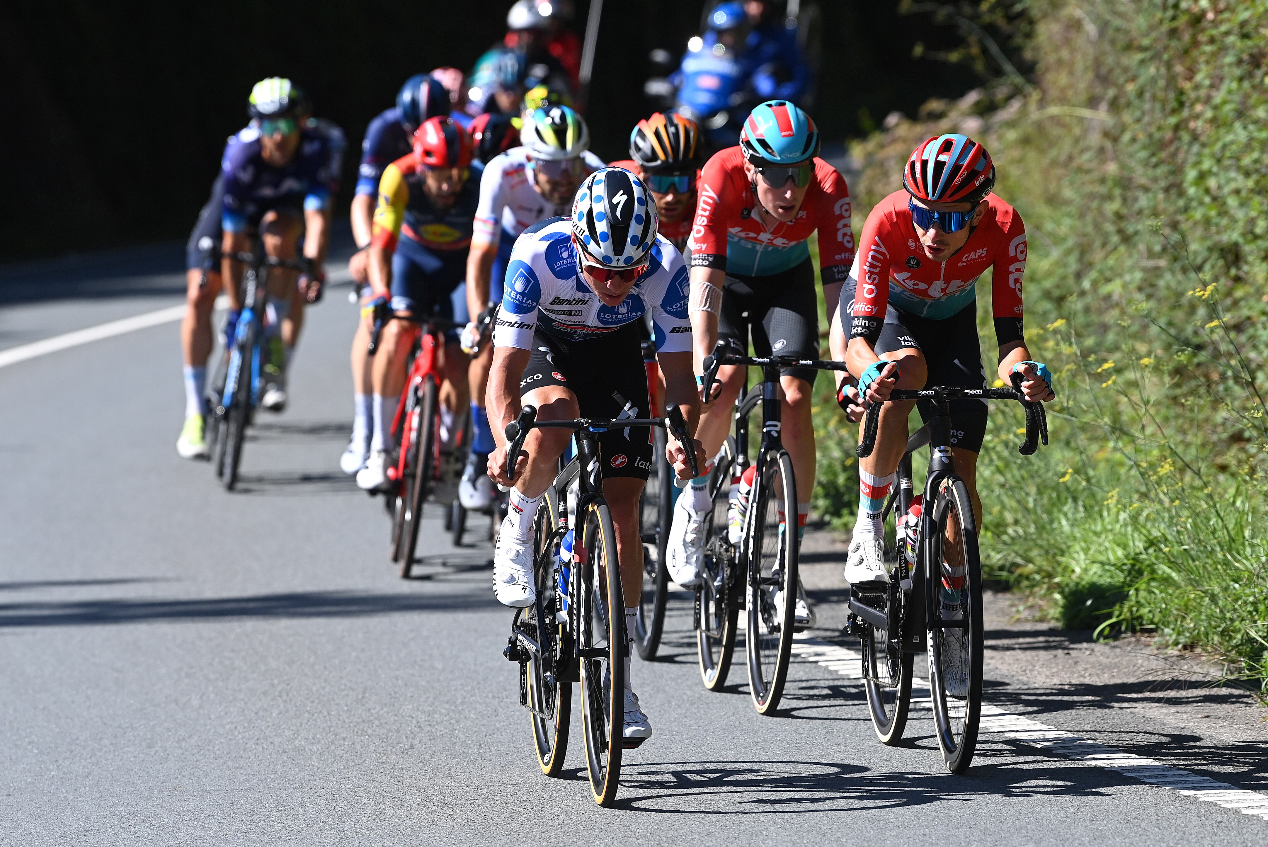 LA-CRUZ-DE-LINARES, SPAIN - SEPTEMBER 14: (L-R) Remco Evenepoel of Belgium and Team Soudal - Quick Step - Polka dot Mountain Jersey and Andreas Kron of Denmark and Team Lotto Dstny compete in the breakaway prior to the 78th Tour of Spain 2023, Stage 18 a 178.9km stage from Pola de Allande to La Cruz de Linares 840m / #UCIWT / on September 14, 2023 in La Cruz de Linares, Spain. (Photo by Tim de Waele/Getty Images)