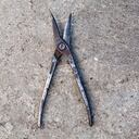 Old metal snips (shears, scissors). Hand tool for cutting metal. Close-up.