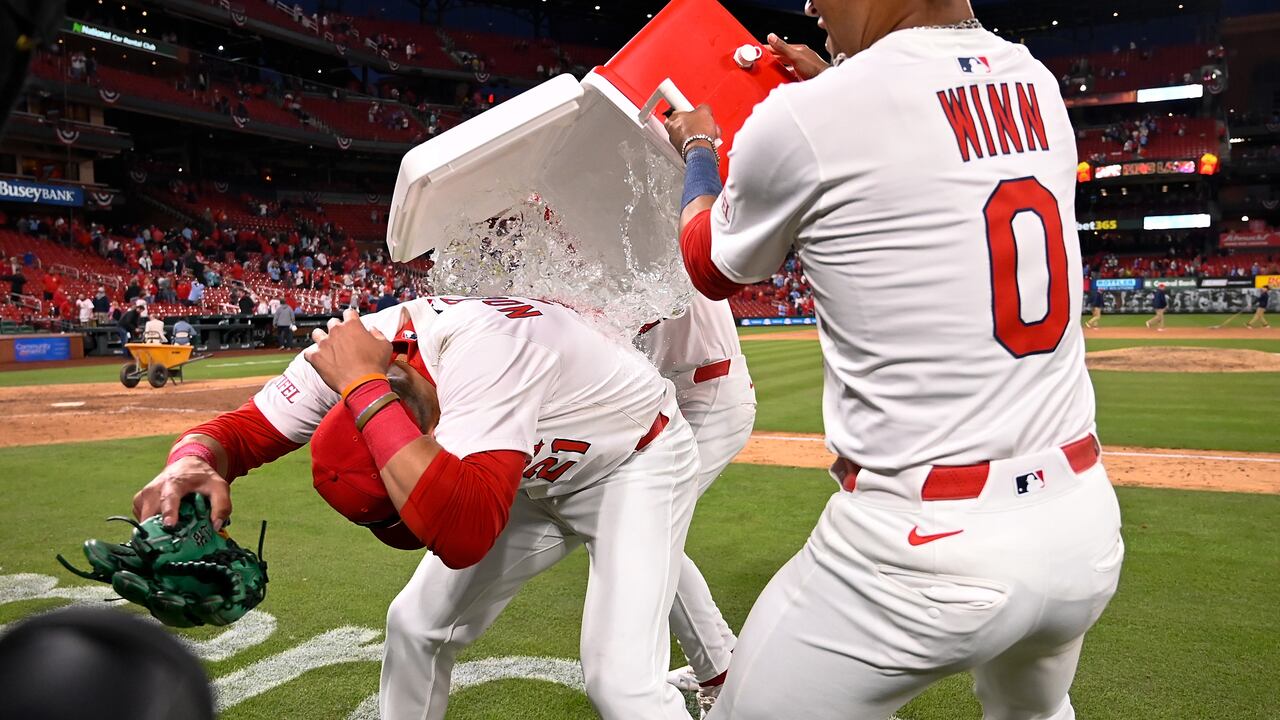 ST LOUIS, MISSOURI - MARCH 27: Lars Nootbaar #21 of the St. Louis Cardinals is doused with water by Masyn Winn #0 after they defeated the Minnesota Twins on Opening Day at Busch Stadium on March 27, 2025 in St Louis, Missouri. (Photo by Joe Puetz/Getty Images)