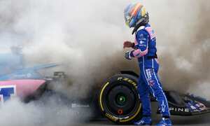Alpine driver Fernando Alonso of Spain gets out of his car during a Formula One pre-season testing session at the Catalunya racetrack in Montmelo, just outside of Barcelona, Spain, Friday, Feb. 25, 2022. (AP Photo/Joan Monfort)