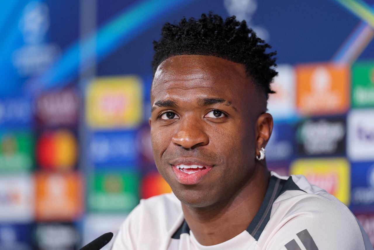 Real Madrid's Brazilian forward #07 Vinicius Juniori attends a press conference on the eve of the UEFA Champions League Round of 16 first leg football match between Real Madrid CF and Club Atletico de Madrid at Real Madrid Sports City in Valdebebas, on the outskirts of Madrid, on March 3, 2025. (Photo by Thomas COEX / AFP)