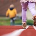 SYMBOL - 19 April 2023, Baden-Württemberg, Rottweil: Children running on a tartan track. Photo: Silas Stein/dpa (Photo by Silas Stein/picture alliance via Getty Images)