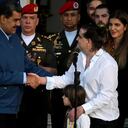 Venezuela's President Nicolas Maduro (L) shakes hands with Colombian businessman Alex Saab upon his arrival at the Miraflores Presidential Palace in Caracas on December 20, 2023. Alex Saab, alleged to be a "front man" for Venezuelan President Nicolas Maduro, arrived in the Caribbean country after being released from the United States, where he was on trial for money laundering. (Photo by Federico Parra / AFP)