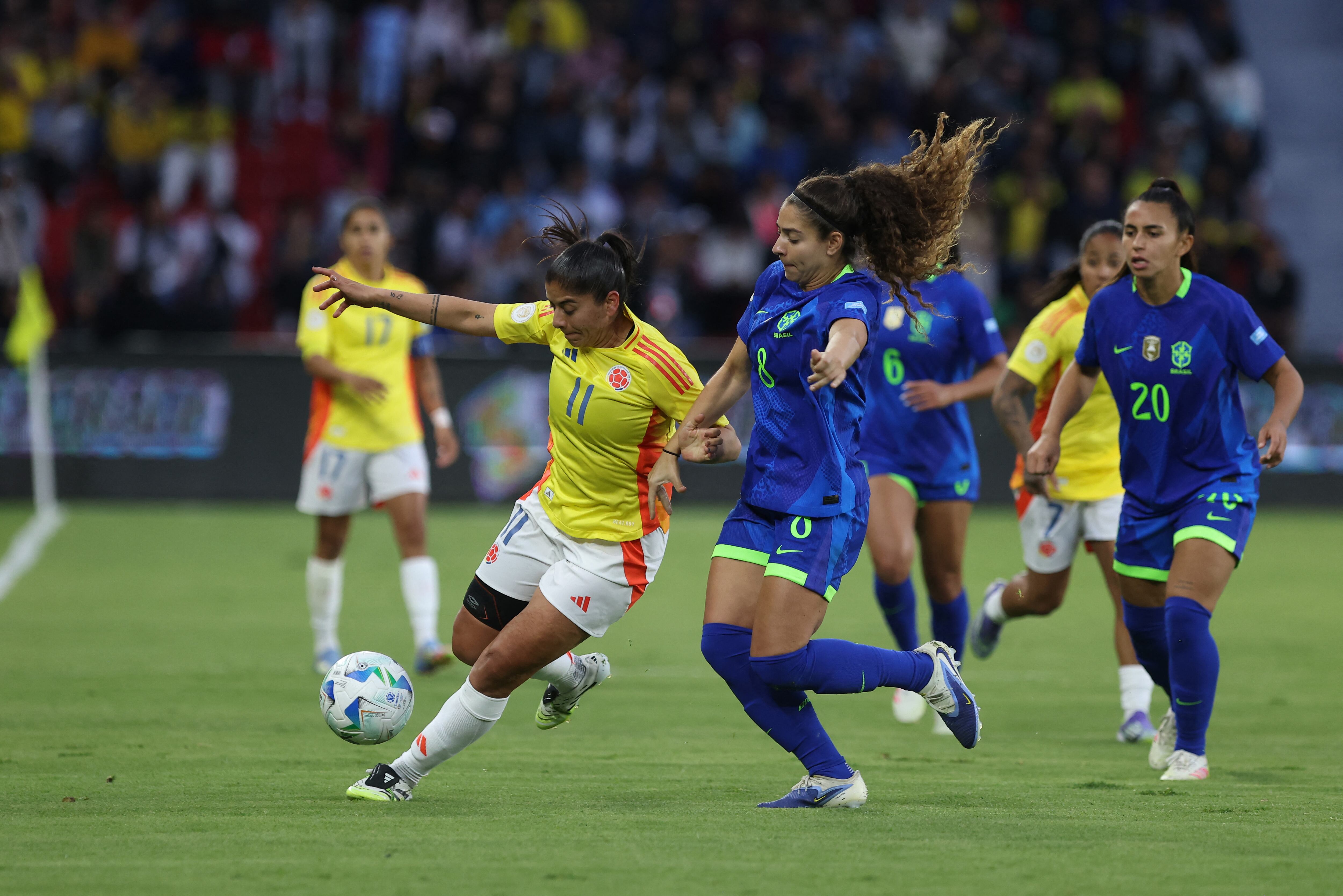 QUITO, ECUADOR - AUGUST 2: Catalina Usme of Colombia battles for possession against Angelina Alonso of Brazil during the CONMEBOL Copa America Femenina 2025 Final match between Colombia and Brazil at Rodrigo Paz Delgado Stadium on August 2, 2025 in Quito, Ecuador. (Photo by Franklin Jacome/Getty Images) (Photo by Franklin Jacome / Getty Images South America / Getty Images via AFP)