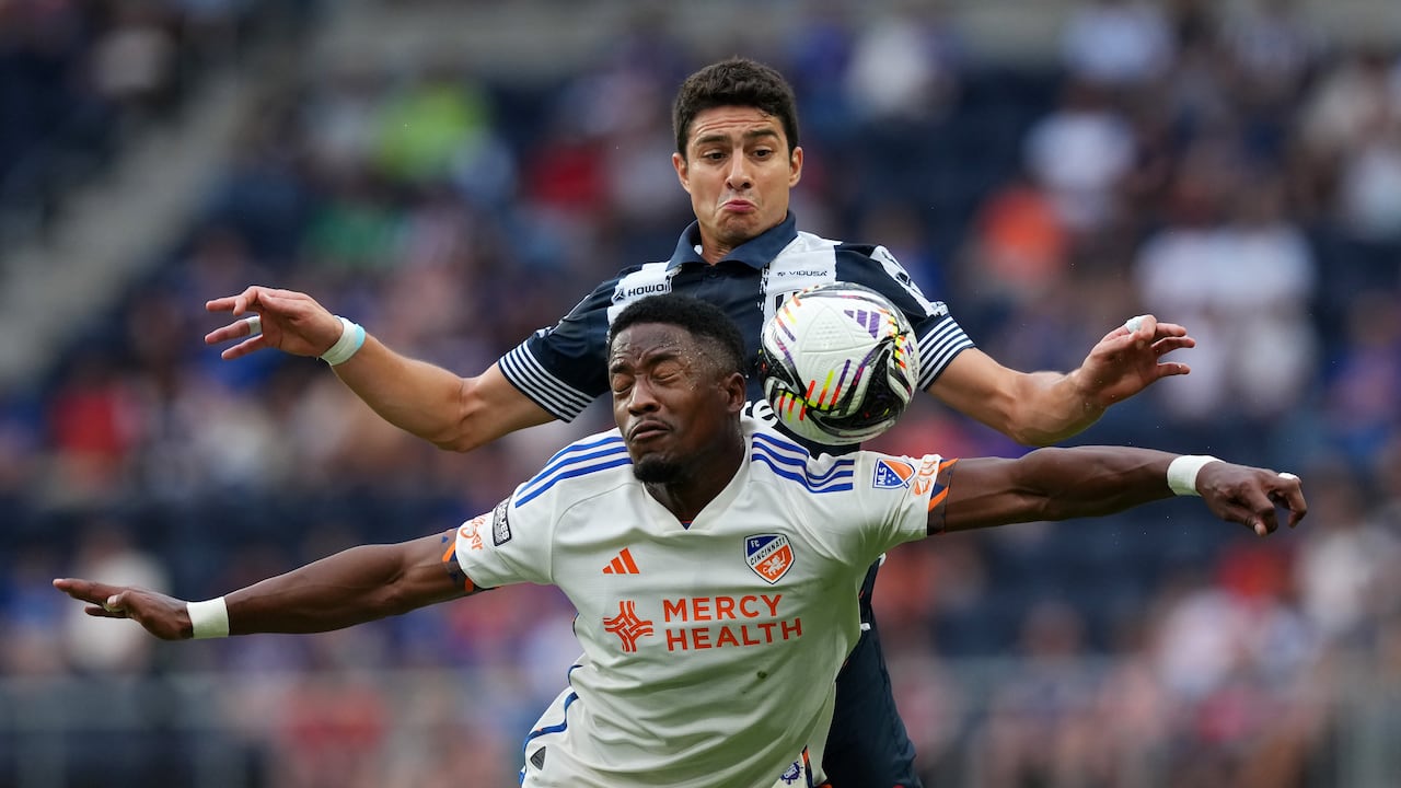 CINCINNATI, OHIO - JULY 31: Sergio Santos #17 of FC Cincinnati and Stefan Medina #33 of CF Monterrey jump for a header in the first half during the Leagues Cup Phase One match between CF Monterrey and FC Cincinnati at TQL Stadium on July 31, 2025 in Cincinnati, Ohio. (Photo by Dylan Buell - Leagues Cup/MLS via Getty Images)