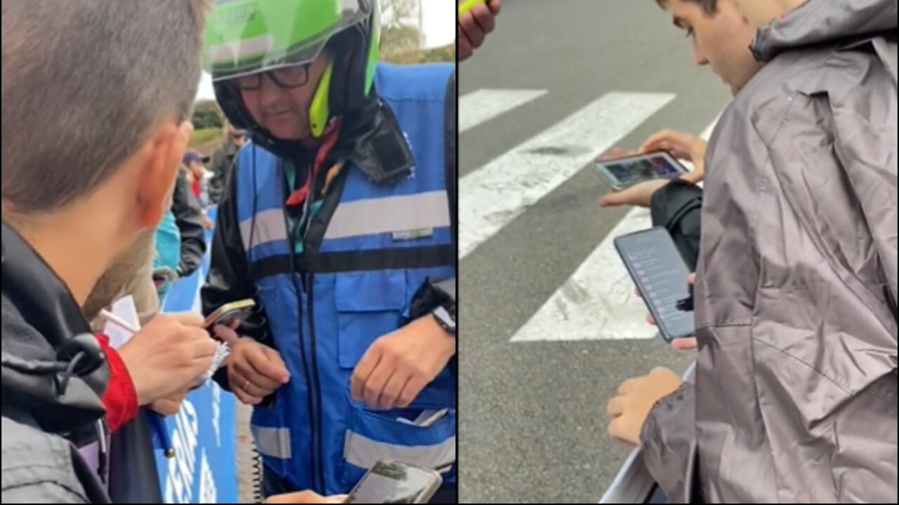 El comisario de carrera pregunta a aficionados si han grabado el paso de los ciclistas.