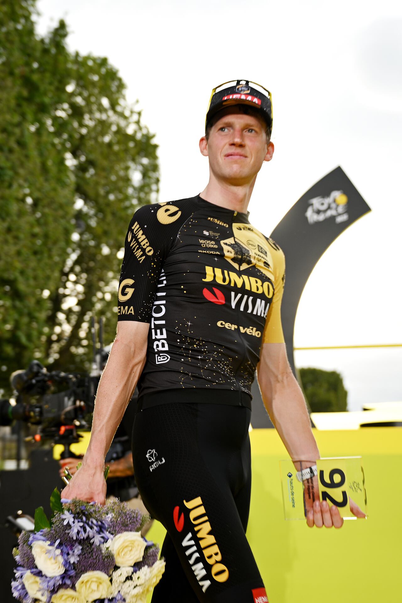 PARIS, FRANCE - JULY 23: Nathan Van Hooydonck of Belgium and Team Jumbo-Visma celebrates at podium as best team prize winner during the stage twenty-one of the 110th Tour de France 2023 a 11 5.1km stage from Saint-Quentin-en-Yvelines to Paris / #UCIWT / on July 23, 2023 in Paris, France. (Photo by David Ramos/Getty Images)
