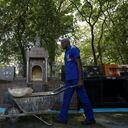 Osmair Camargo Candido, 60, known as Fininho, works as a gravedigger at a cemetery in Sao Paulo, Brazil, on September 28, 2021. - Fininho, who has worked for over 30 years as a gravedigger, is a philosophy teacher, gives vocational courses at a school, and is writing a book. (Photo by Miguel SCHINCARIOL / AFP)