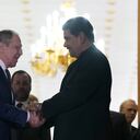 Venezuela's President Nicolas Maduro, right, shakes hands with Russia's Foreign Minister Sergei Lavrov after a meeting at Miraflores Presidential Palace in Caracas, Venezuela, Tuesday, April 18, 2023. (AP Photo/Ariana Cubillos)