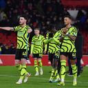 Arsenal's players wave their supporters at the end of the English Premier League soccer match between Nottingham Forest and Arsenal at the City Ground stadium in Nottingham, England, Tuesday, Jan. 30, 2024. Arsenal won 2-1. (AP Photo/Rui Vieira)