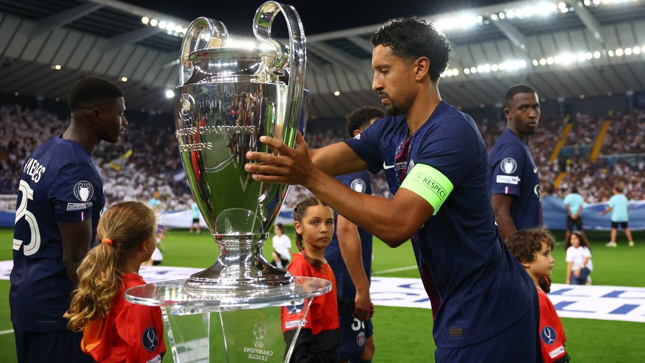 UDINE, ITALY - AUGUST 13: Marquinhos of Paris Saint-Germain holds the Champions League trophy prior to the UEFA Super Cup 2025 match between Paris Saint-Germain and Tottenham Hotspur at Friuli Stadium on August 13, 2025 in Udine, Italy. (Photo by Chris Brunskill/Fantasista/Getty Images)