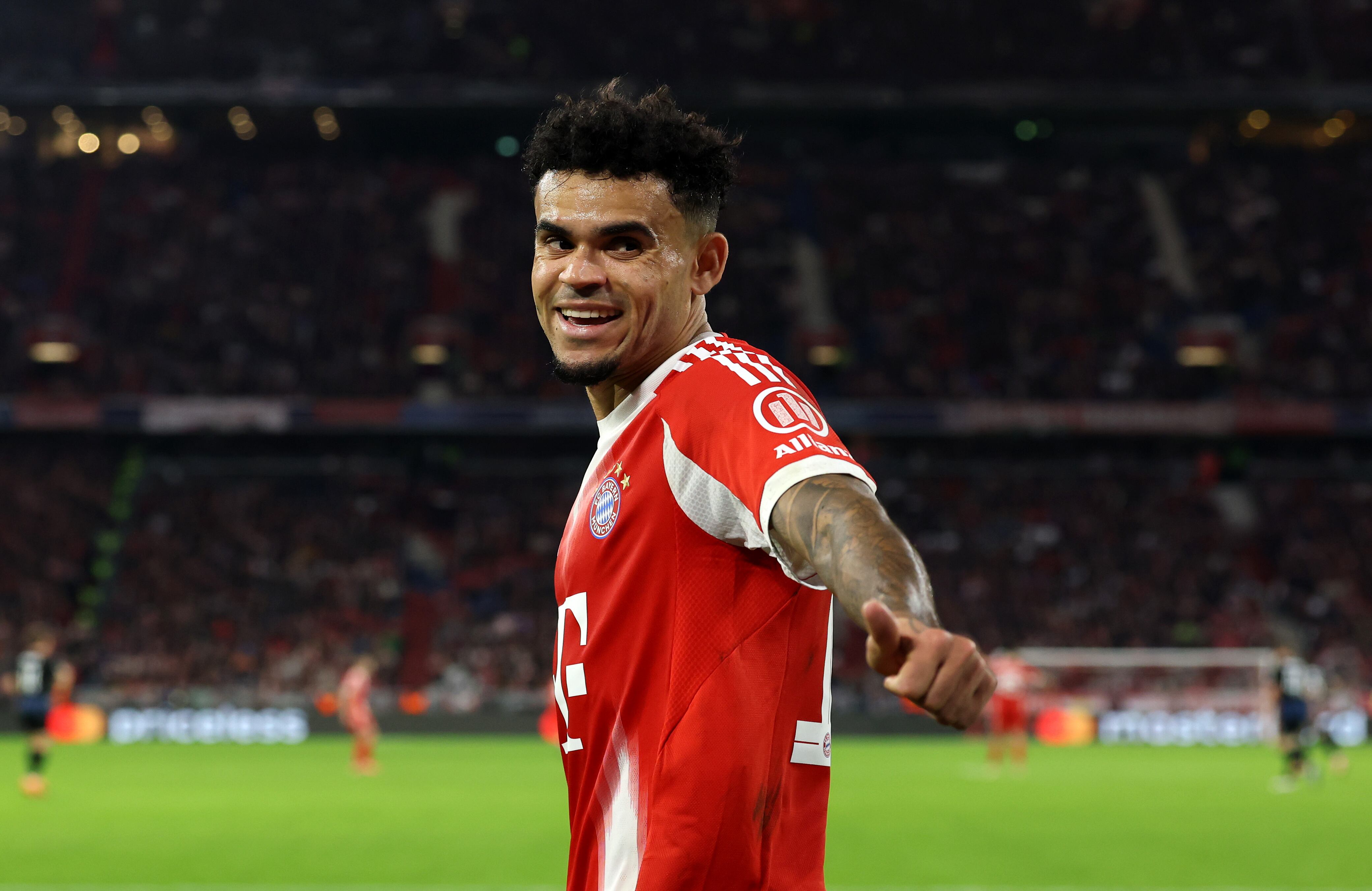 MUNICH, GERMANY - OCTOBER 22: Luis Diaz of Bayern Munich celebrates after teammate Nicolas Jackson (not pictured) scores his team's fourth goal during the UEFA Champions League 2025/26 League Phase MD3 match between FC Bayern München and Club Brugge KV at Football Arena Munich on October 22, 2025 in Munich, Germany. (Photo by Alexander Hassenstein/Getty Images)