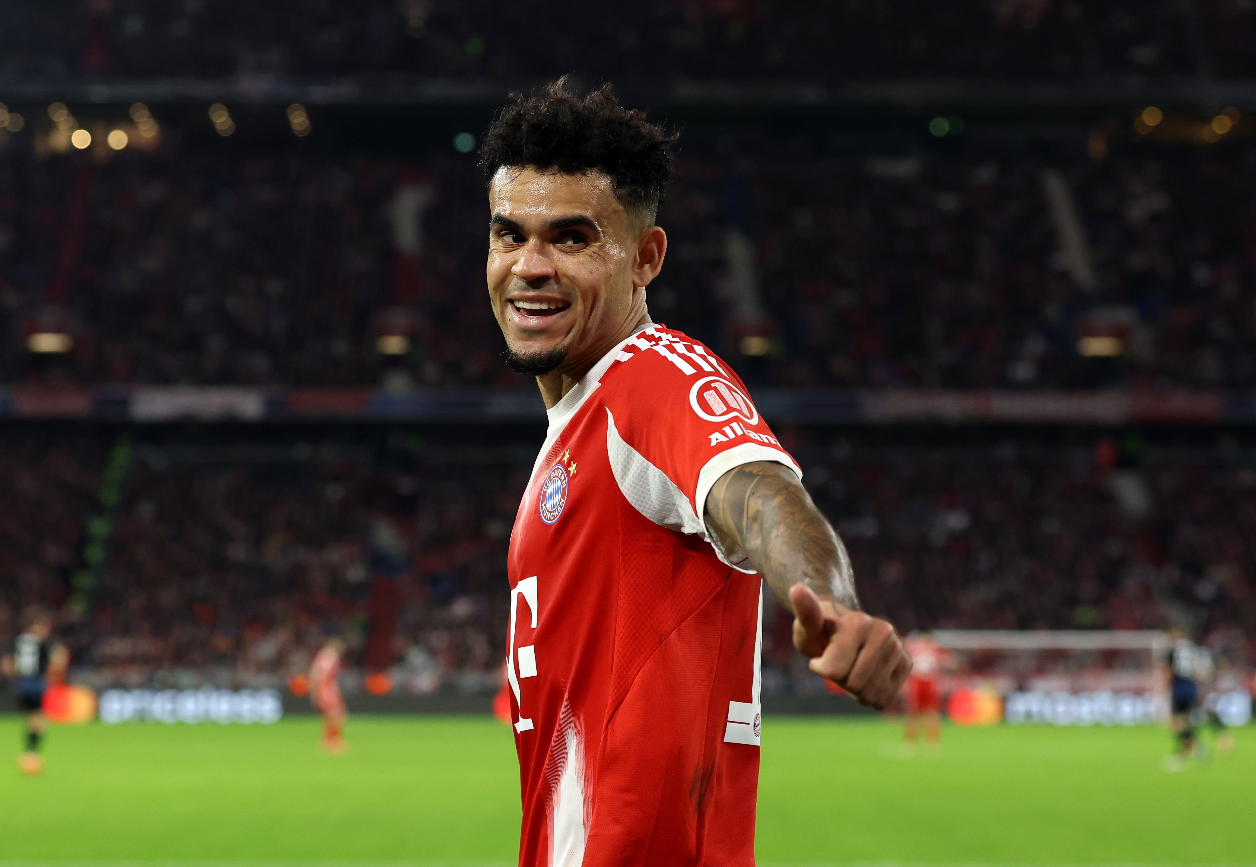 MUNICH, GERMANY - OCTOBER 22: Luis Diaz of Bayern Munich celebrates after teammate Nicolas Jackson (not pictured) scores his team's fourth goal during the UEFA Champions League 2025/26 League Phase MD3 match between FC Bayern München and Club Brugge KV at Football Arena Munich on October 22, 2025 in Munich, Germany. (Photo by Alexander Hassenstein/Getty Images)