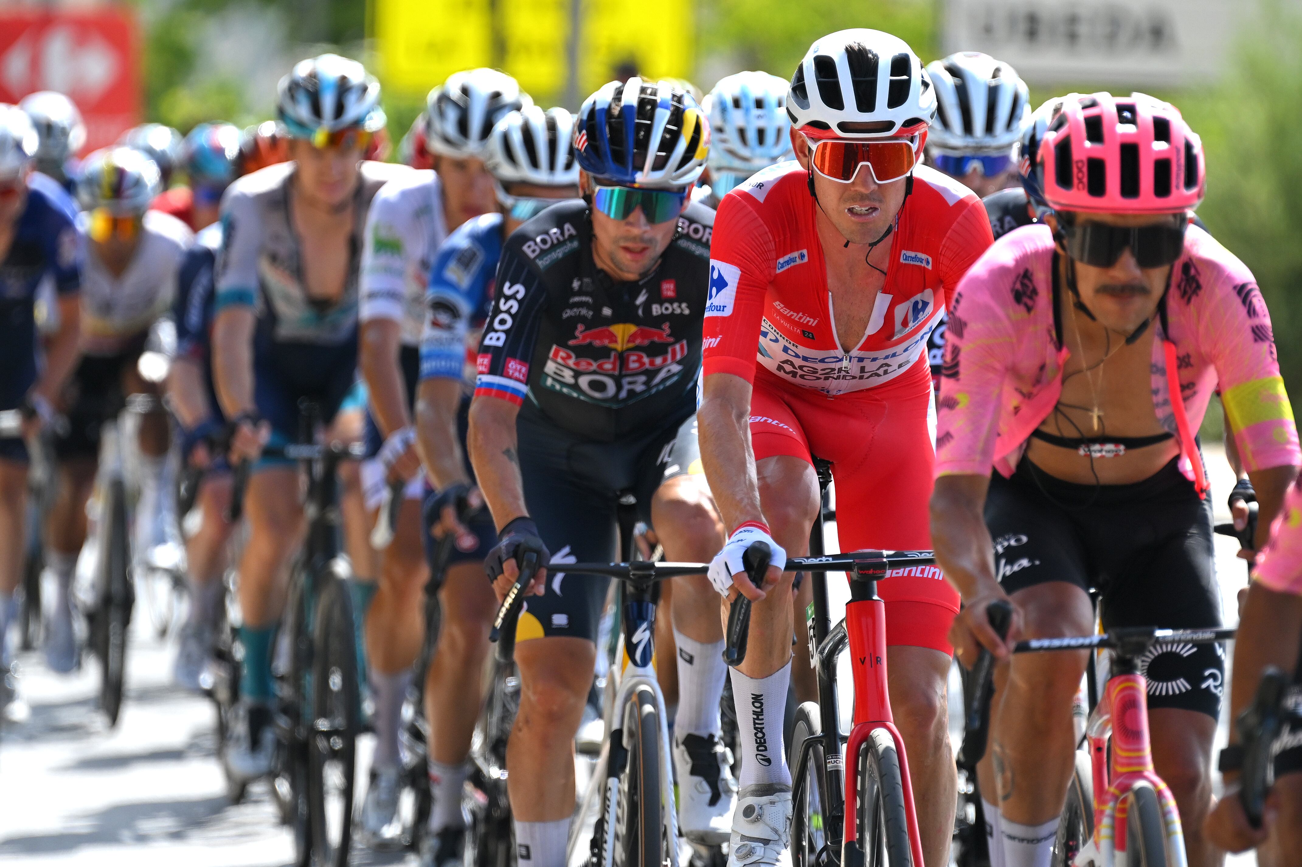 CAZORLA, SPAIN - AUGUST 24: (L-R) Primoz Roglic of Slovenia and Team Red Bull Bora - hansgrohe and Ben O'Connor of Australia and Team Decathlon AG2R La Mondiale - Red Leader Jersey compete during the La Vuelta - 79th Tour of Spain 2024, Stage 8 a159km stage from Ubeda to Cazorla 1056m / #UCIWT / on August 24, 2024 in Cazorla, Spain. (Photo by Tim de Waele/Getty Images)