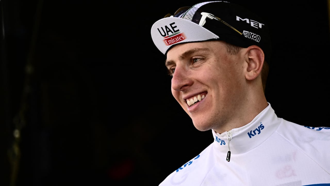 UAE Team Emirates' Slovenian rider Tadej Pogacar celebrates on the podium with the best young rider's white jersey after the 1st stage of the 110th edition of the Tour de France cycling race, 182 km departing and finishing in Bilbao, in northern Spain, on July 1, 2023. (Photo by Marco BERTORELLO / AFP)