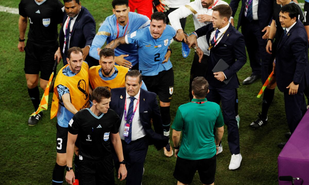 Soccer Football - FIFA World Cup Qatar 2022 - Group H - Ghana v Uruguay - Al Janoub Stadium, Al Wakrah, Qatar - December 2, 2022 Uruguay players remonstrate with the referee Daniel Siebert after the match REUTERS/Albert Gea