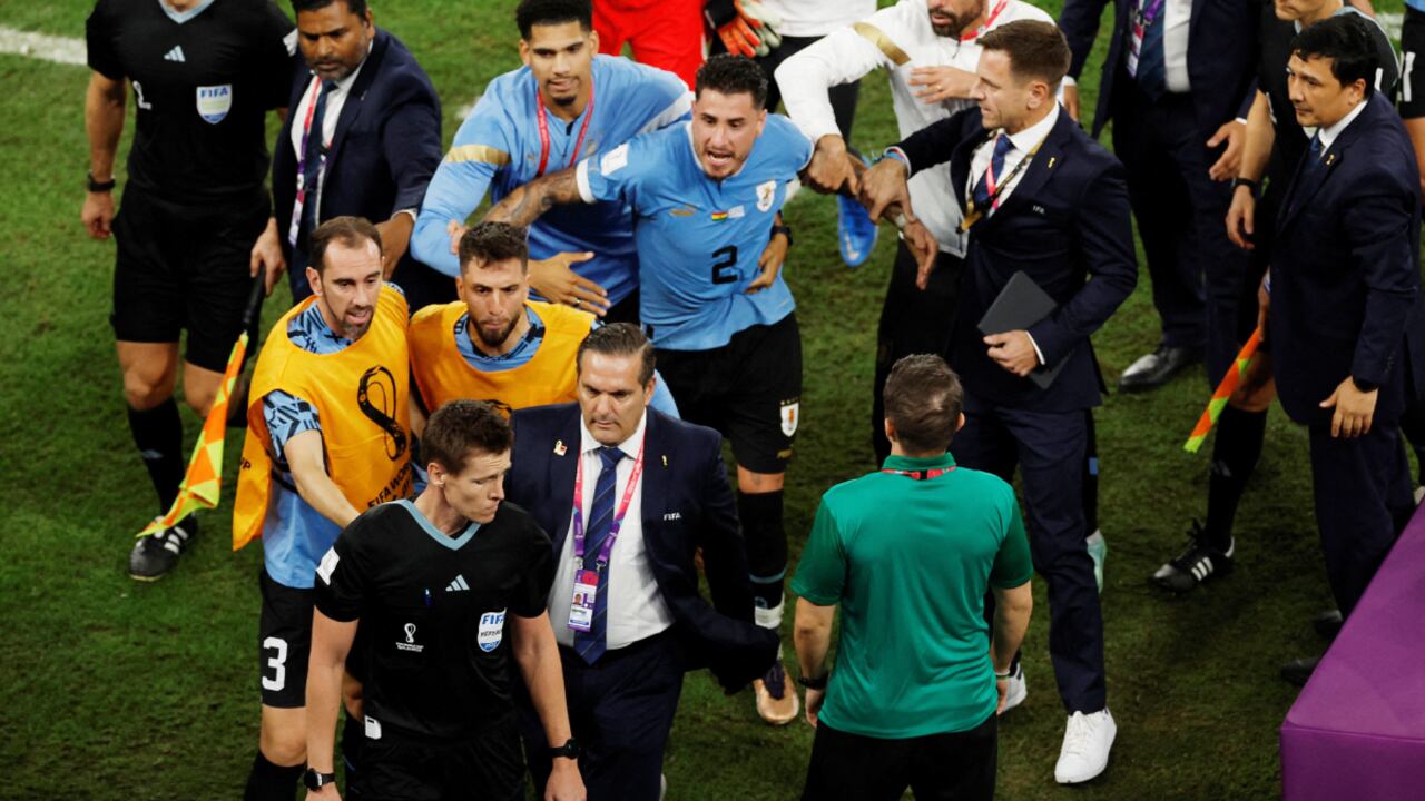 Soccer Football - FIFA World Cup Qatar 2022 - Group H - Ghana v Uruguay - Al Janoub Stadium, Al Wakrah, Qatar - December 2, 2022 Uruguay players remonstrate with the referee Daniel Siebert after the match REUTERS/Albert Gea