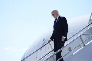 President Joe Biden steps off Air Force One as he arrives at John Murtha Johnstown-Cambria County Airport in Johnstown, Pa., to attend a ceremony marking the anniversary of the Sept. 11 terror attacks at the Flight 93 National Memorial, Wednesday, Sept. 11, 2024, in Shanksville, Pa. (AP Photo/Evan Vucci)