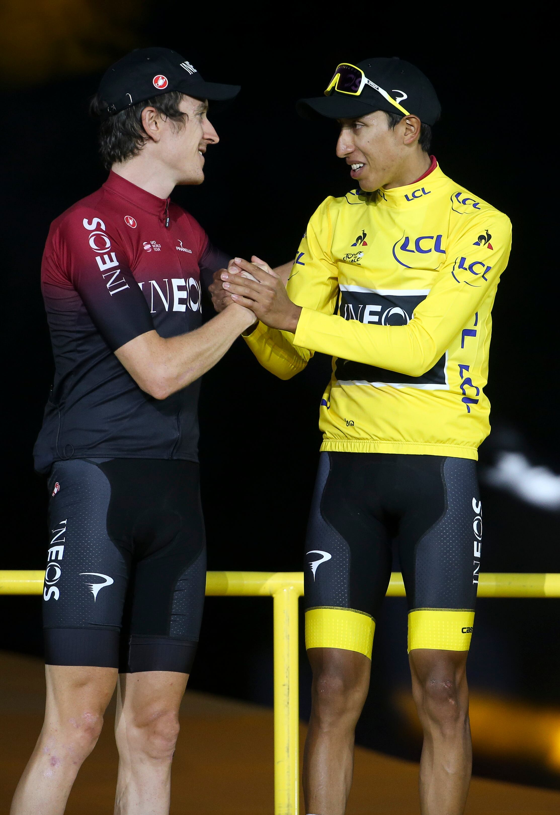 PARIS, FRANCE - JULY 28: Second place Geraint Thomas of Great Britain and Team Ineos, winner of Tour de France 2019 yellow jersey Egan Bernal Gomez of Colombia and Team Ineos during the podium ceremony following stage 21 of the 106th Tour de France 2019, the last stage from Rambouillet to Paris - Champs Elysees (128km) on July 28, 2019 in Paris, France. (Photo by Jean Catuffe/Getty Images)