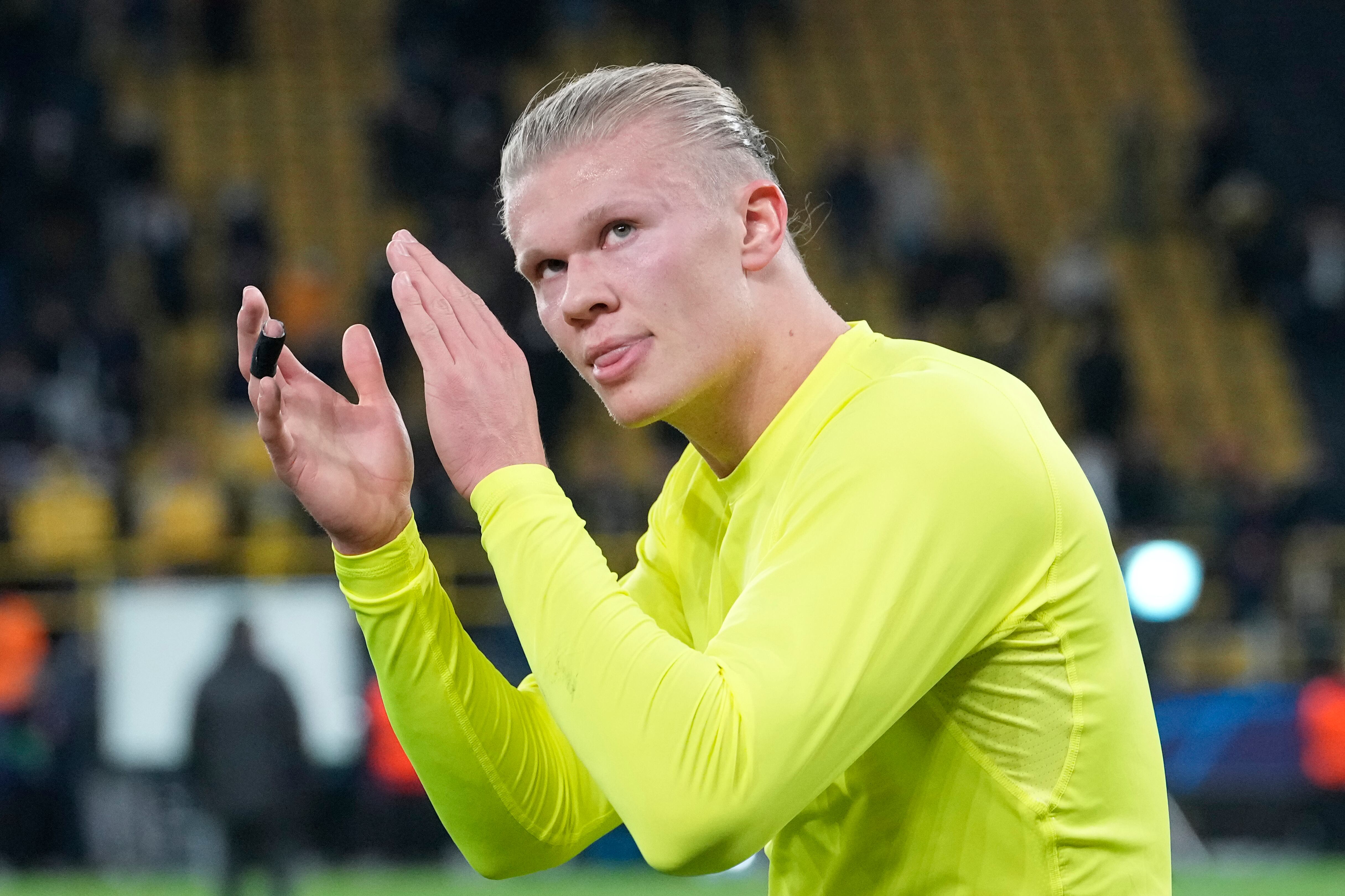 Dortmund's Erling Haaland applauds the fans after the end of the Champions League group C soccer match between Borussia Dortmund and Besiktas Istanbul in Dortmund, Germany, Tuesday, Dec. 7, 2021. Dortmund won the game 5-0, with Haaland scor