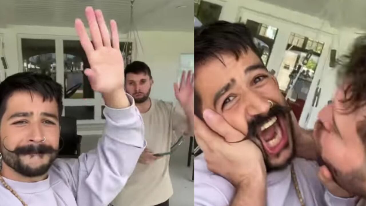 El cantante Camilo y el hombre que intentó besarlo.