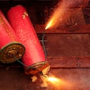 two burning firecrackers