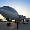 Passengers board a Qatar Airways aircraft at the airport in Kabul on September 9, 2021. - Some 200 passengers, including US citizens, left Kabul airport on September 9, 2021, on the first flight carrying foreigners out of the Afghan capital since a US-led evacuation ended on August 30. (Photo by WAKIL KOHSAR / AFP)