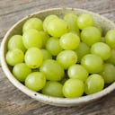 Natural light photo of small bowl of organic green grapes on rustic wood backgroundPlease view more rustic food images here: