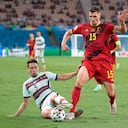 Portugal's Raphael Guerreiro, left, and Belgium's Thomas Meunier challenge for the ball during the Euro 2020 soccer championship round of 16 match between Belgium and Portugal at the La Cartuja stadium in Seville, Spain,Sunday, June 27, 2021. (AP Photo/Thanassis Stavrakis, Pool)