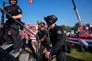 Republican presidential candidate former U.S. Secret Service agents rush the stage during. Campaign rally with Republican presidential candidate former President Donald Trump Saturday, July 13, 2024, in Butler, Pa. (AP Photo/Evan Vucci)