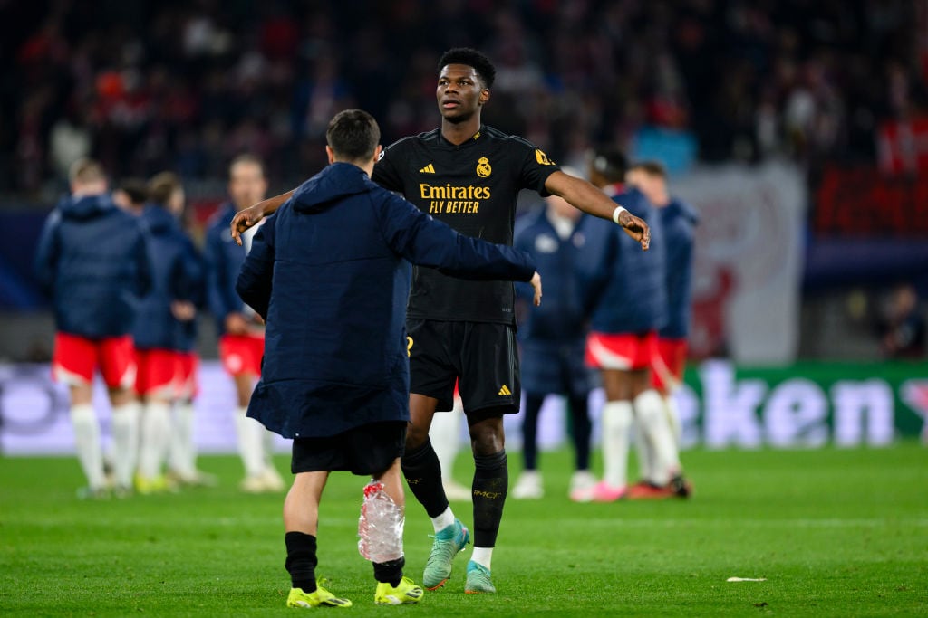 LEIPZIG, GERMANY - FEBRUARY 13: Aurelien Tchouameni of Real Madrid shake hands with Brahim Diaz (L)  after the UEFA Champions League 2023/24 round of 16 first leg match between RB Leipzig and Real Madrid CF at Red Bull Arena on February 13, 2024 in Leipzig, Germany. (Photo by Marvin Ibo Guengoer - GES Sportfoto/Getty Images)