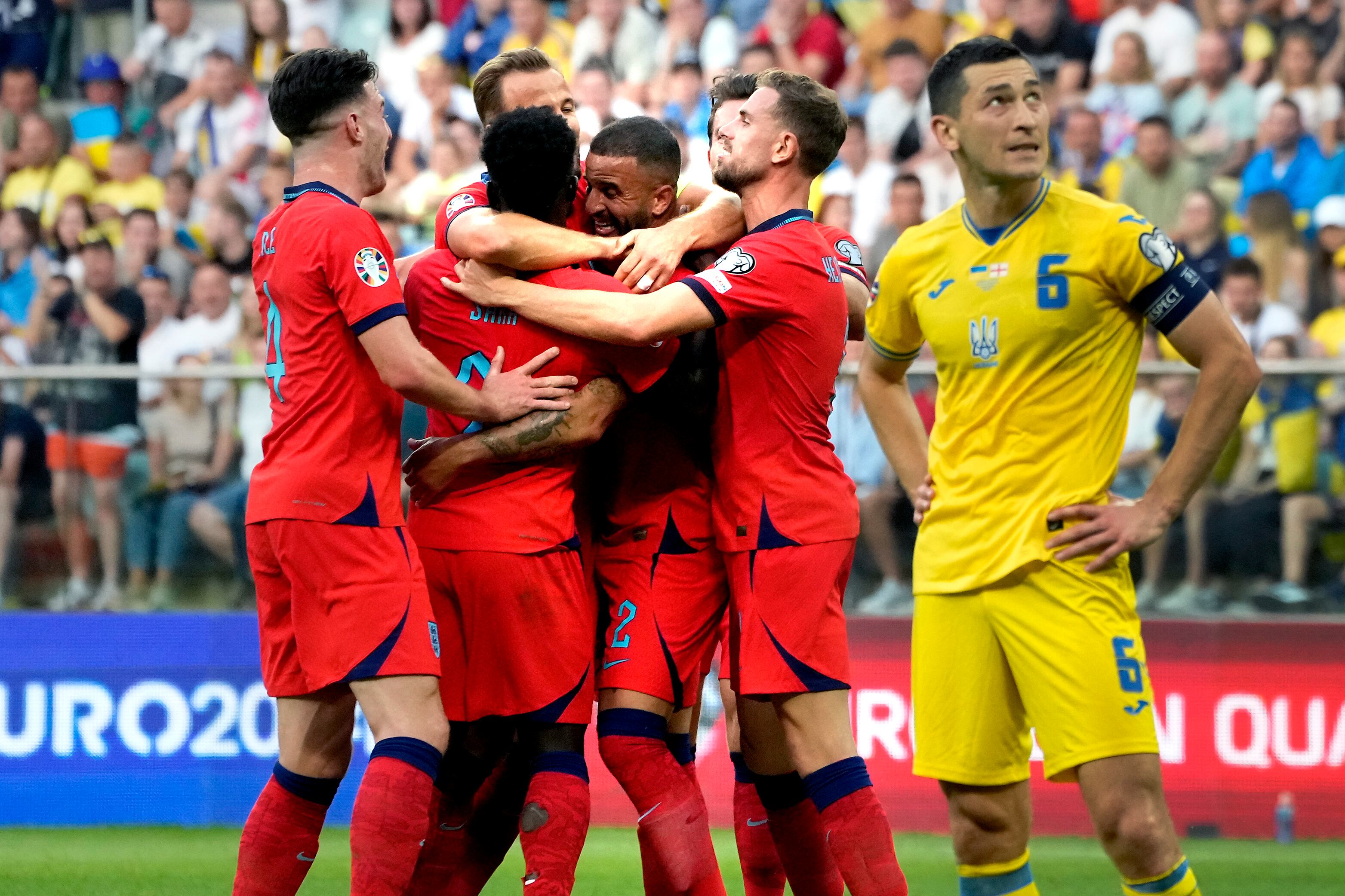 England's Kyle Walker, center, celebrates after scoring his side's first goal during the Euro 2024 group C qualifying soccer match between Ukraine and England in Wroclaw, Poland, Saturday, Sept. 9, 2023. (AP Photo/Czarek Sokolowski)