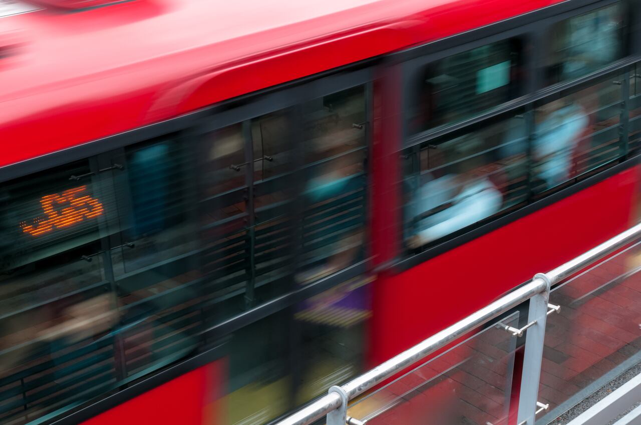 Red public bus in Bogota at fast speeds. Bogota Colombia .