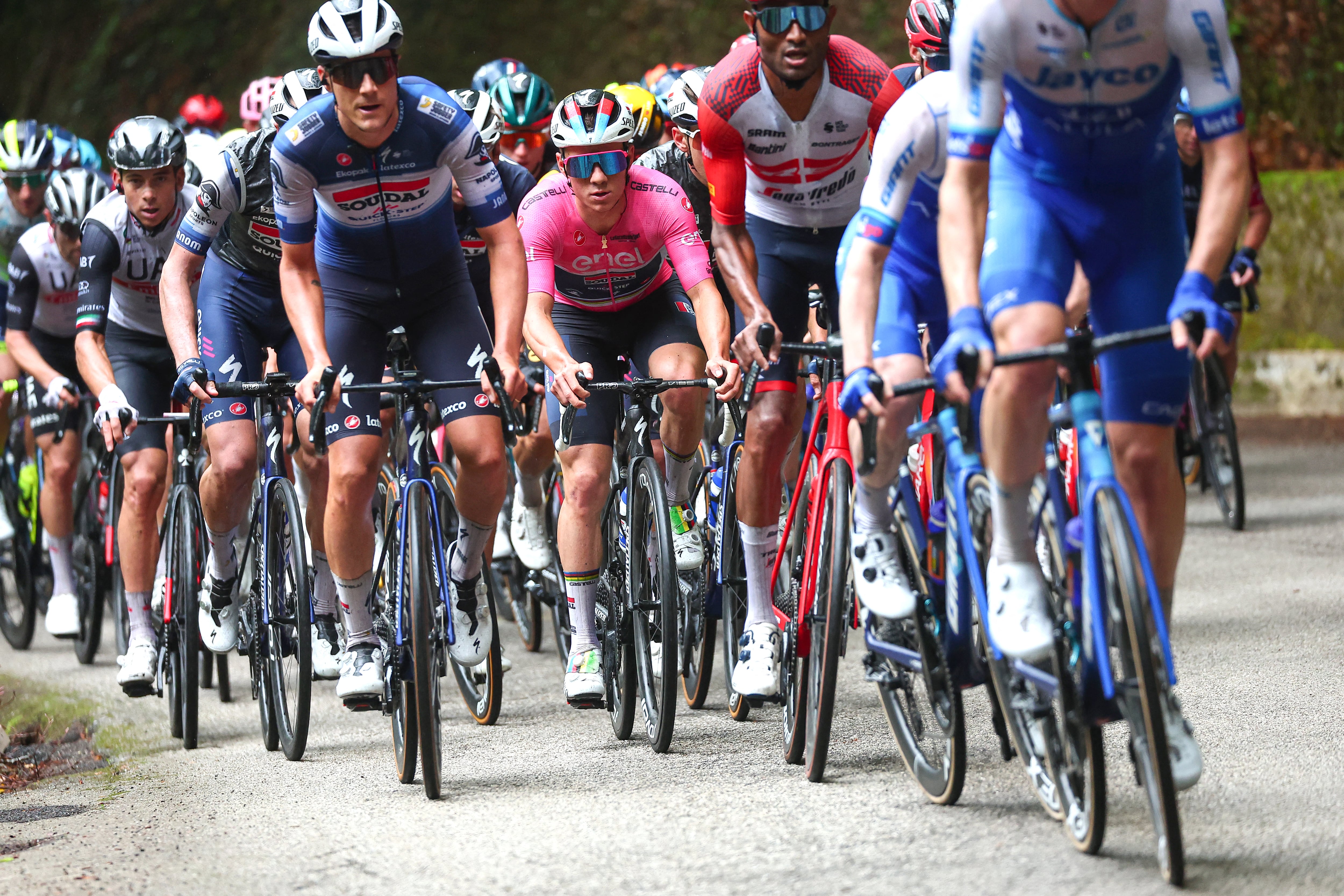 Soudal - Quick Step's Belgian rider Remco Evenepoel (C), wearing the overall leader's pink jersey, competes during the third stage of the Giro d'Italia 2023 cycling race, 216 km between Vasto and Melfi, on May 8, 2023. (Photo by Luca Bettini / AFP)