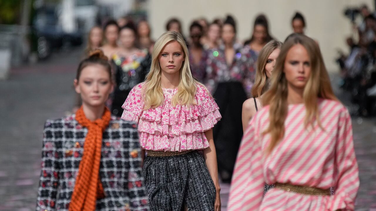 Models wear creations for the Chanel Haute Couture Fall/Winter 2023-2024 fashion collection presented in Paris, Tuesday, July 4, 2023. (AP Photo/Christophe Ena)