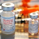 FILE - In this Feb. 25, 2021, file photo, vials for the Moderna and Pfizer COVID-19 vaccines are displayed on a tray at a clinic set up by the New Hampshire National Guard in the parking lot of Exeter, N.H., High School. An untold number of Americans have managed to get COVID-19 booster shots even though the U.S. government hasn't approved them. They're doing so by taking advantage of the nation’s vaccine surplus and loose tracking of those who have been fully vaccinated. (AP Photo/Charles Krupa, File)