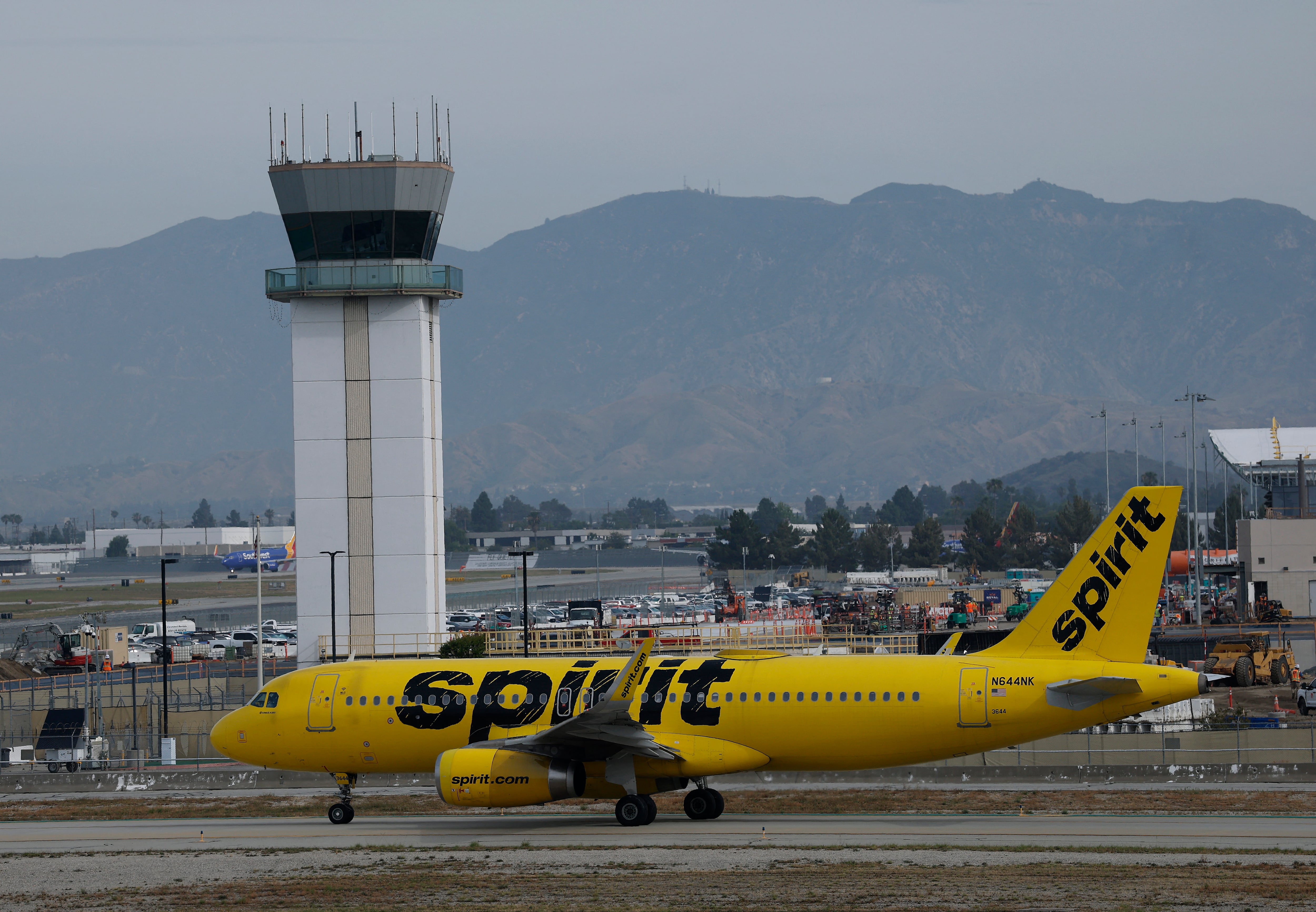 BURBANK, CALIFORNIA - APRIL 16: A Spirit Airlines plane taxis at Hollywood Burbank Airport on April 16, 2026 in Burbank, California. Facing mounting financial pressure, Spirit Airlines is at risk of liquidation within days as surging jet fuel costs tied to the Iran conflict strain its already fragile bankruptcy restructuring efforts.   Justin Sullivan/Getty Images/AFP (Photo by JUSTIN SULLIVAN / GETTY IMAGES NORTH AMERICA / Getty Images via AFP)
