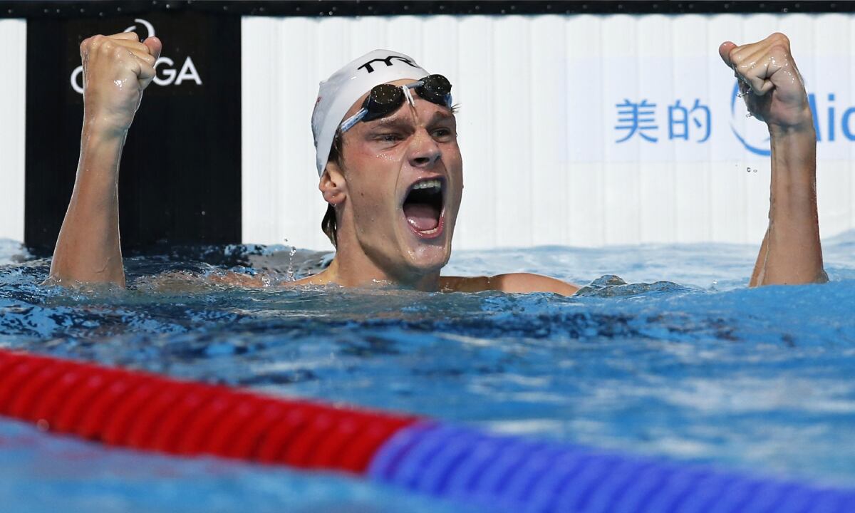 FILE - France's Yannick Agnel celebrates after winning the gold medal in the Men's 200m freestyle final at the FINA Swimming World Championships in Barcelona, Spain, Tuesday, July 30, 2013. More details have emerged over an investigation into the alleged rape of an underage girl by two-time Olympic swimming champion Yannick Agnel of France, who was arrested last week in Paris. Agnel was handed preliminary charges as part of the investigation after being sent to Mulhouse, eastern France. On Monday Dec.13, 2021, Mulhouse prosecutor said the events allegedly took place in 2016 in several locations including Spain, Thailand and Brazil.(AP/Michael Sohn, File)